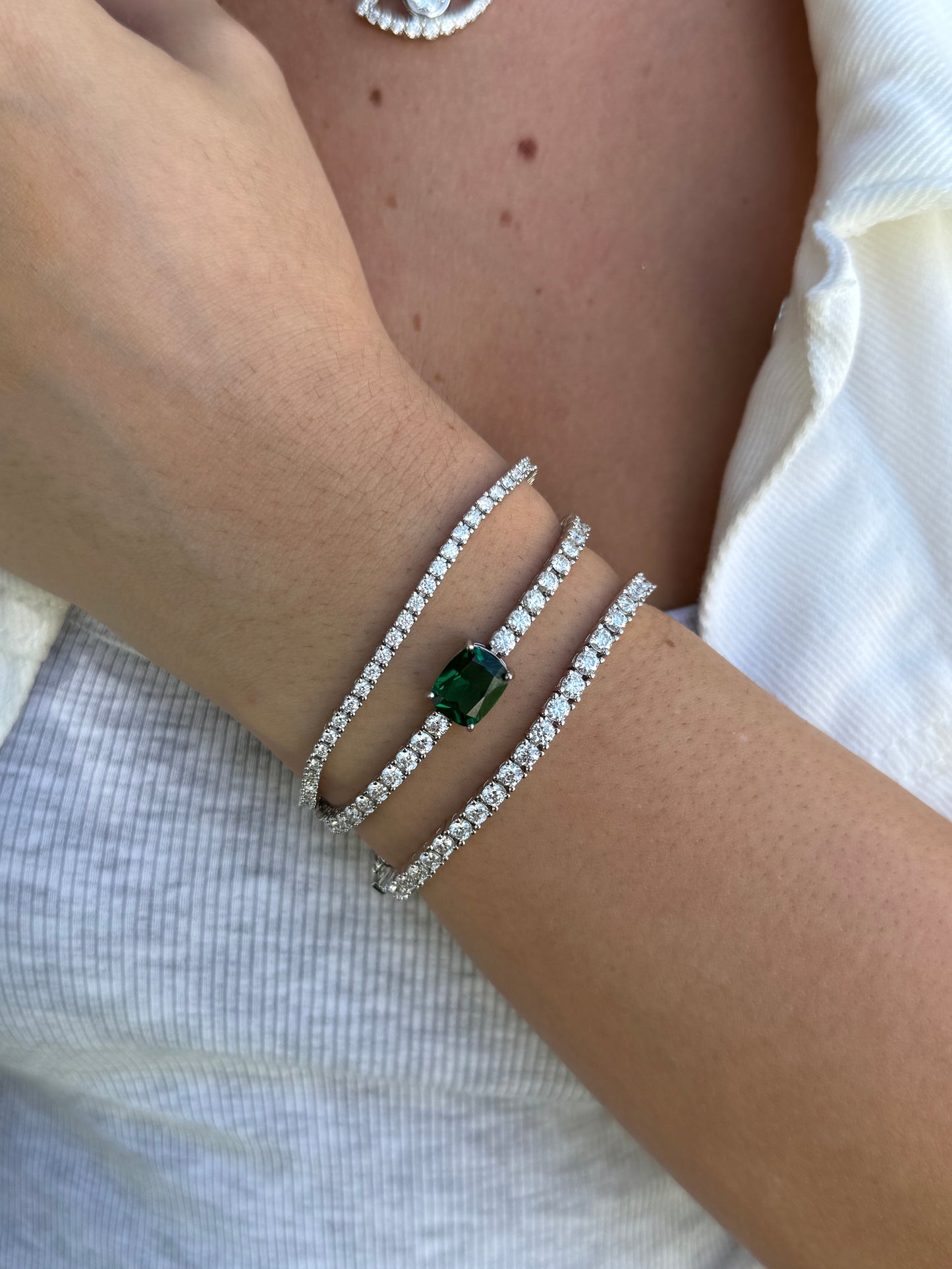 Tennis Bracelet with Emerald/Ruby Center