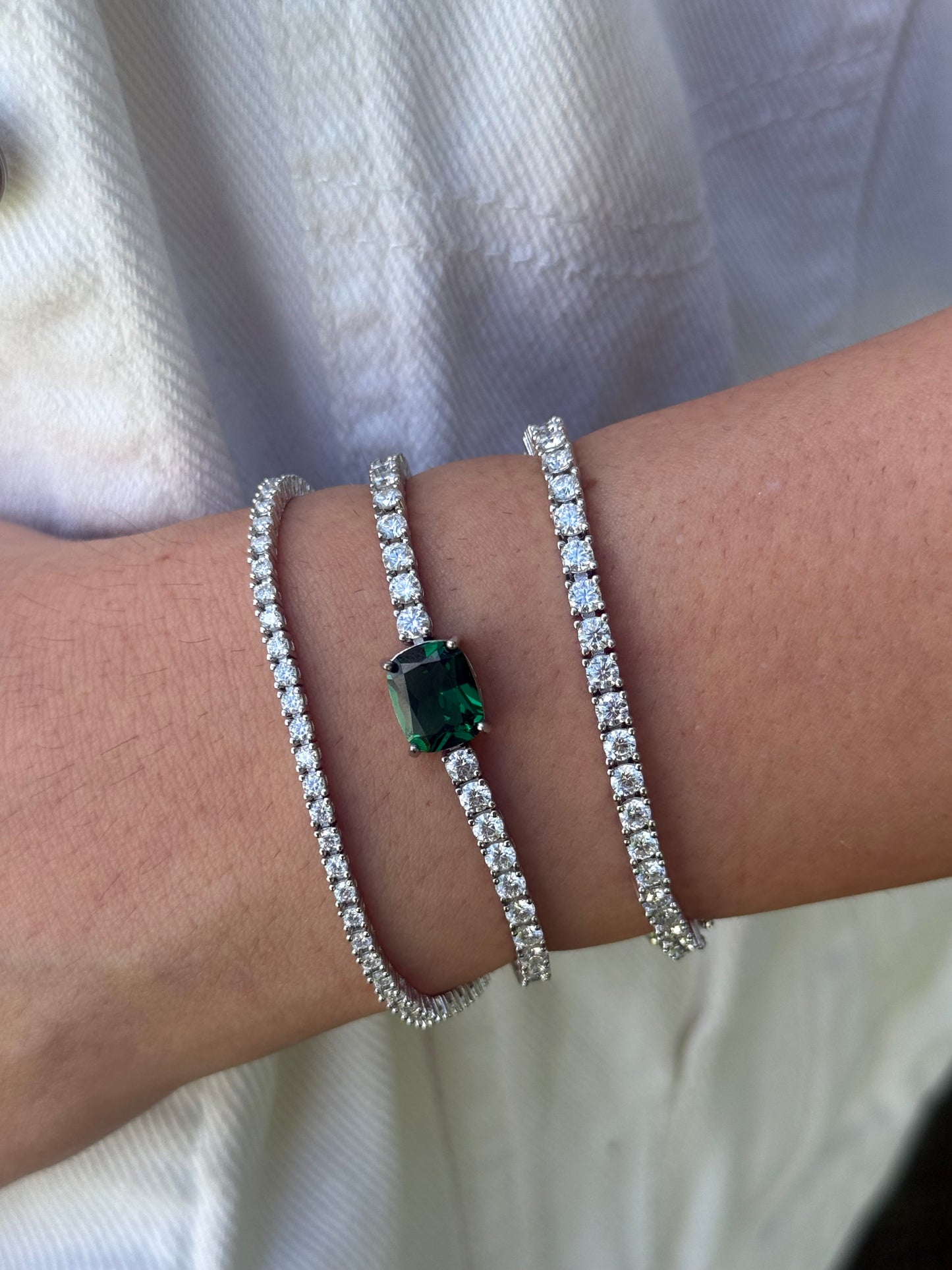 Tennis Bracelet with Emerald/Ruby Center
